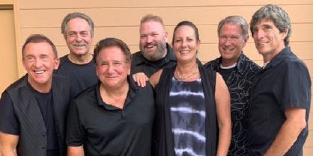 Group photo of The Greaseband smiling